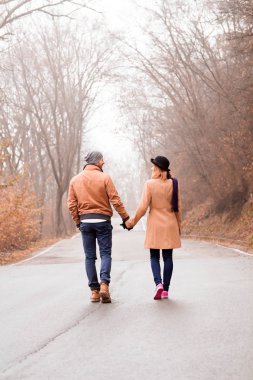 Couple enjoying outdoors in cold autumn / winter time.