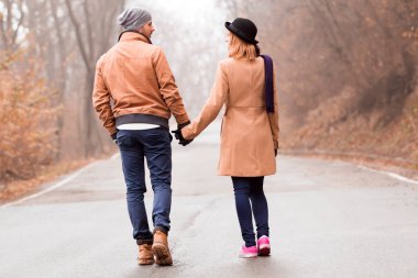 Couple enjoying outdoors in cold autumn / winter time.