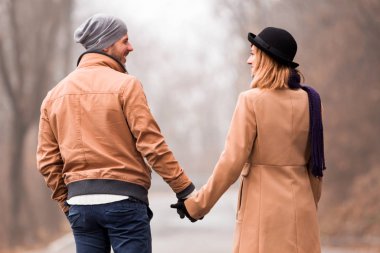 Couple enjoying outdoors in cold autumn / winter time.