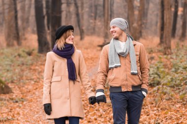 Couple in the park enjoying nice autumn / winter time.