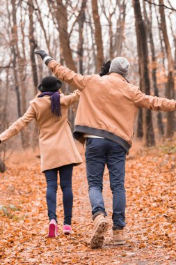 Couple in the park enjoying nice autumn / winter time.