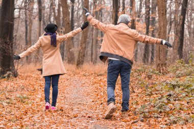 Couple in the park enjoying nice autumn / winter time.