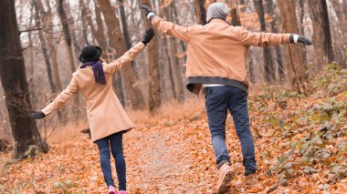 Couple in the park enjoying nice autumn / winter time.