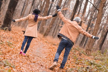 Couple in the park enjoying nice autumn / winter time.