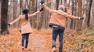 Couple in the park enjoying nice autumn / winter time.