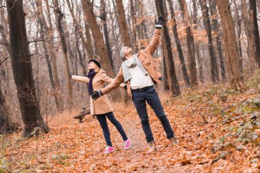 Couple in the park enjoying nice autumn / winter time.
