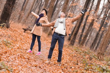 Couple in the park enjoying nice autumn / winter time.