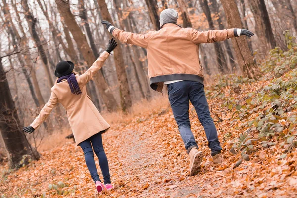 Couple in the park enjoying nice autumn / winter time.