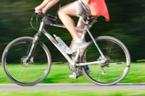 Riding bicycle - blurred motion, fast driving.