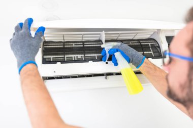 Aircondition service and maintenance, fixing AC unit and cleaning the filters. clipart