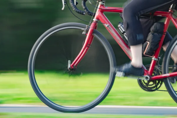 Riding bicycle - blurred motion, fast driving.