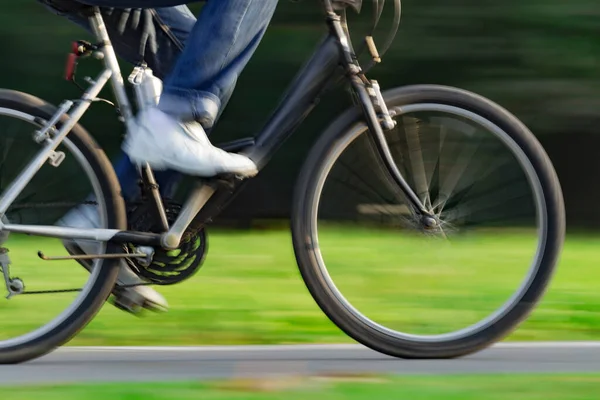 Riding bicycle - blurred motion, fast driving.