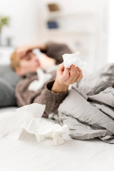 Woman sick in the bed, flu and virus infections, allergy, seasonal health issues.