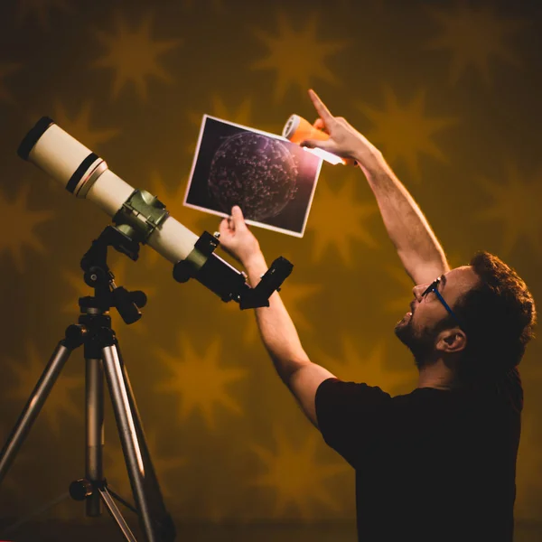 Man looking at the stars through a telescope- astrology concept, horoscope predictions about the future.