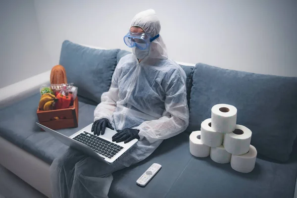 Quarantine and isolation during the virus outbreak - groceries and food in stock, working from home over the internet.