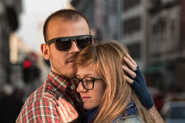 Happy smiley couple enjoying on the street.