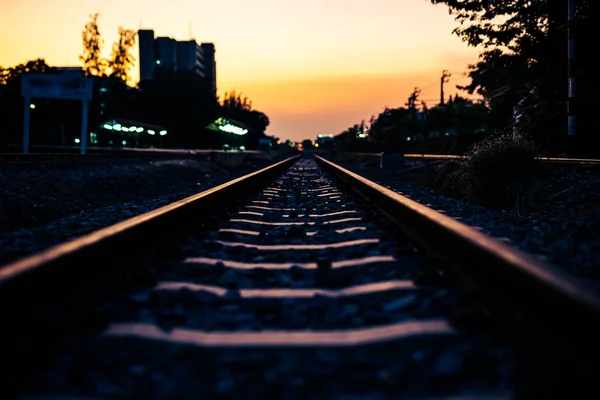 Photos near the sunset light on the train tracks — Stock Photo, Image
