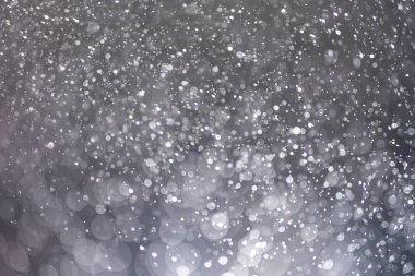 Abstract bokeh from light and water spray in backgrounds of vari