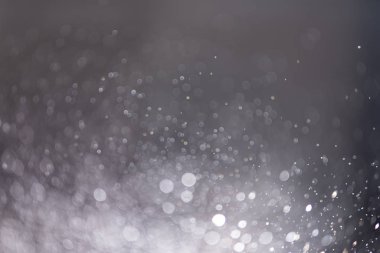 Abstract bokeh from light and water spray in backgrounds of vari