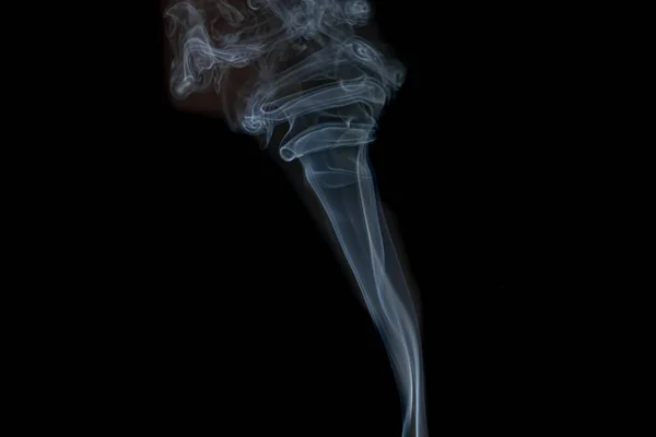 Abstract smoke from incense and light in a black background — Stock Photo, Image