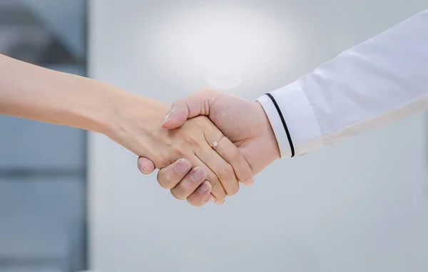 Business men and women shake hands for friendship, shake hands to work together in a team