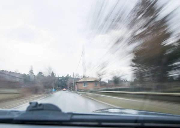 The traffic in the city, car driving, motion blur, sensation of speed of the car on the road, blurred motion