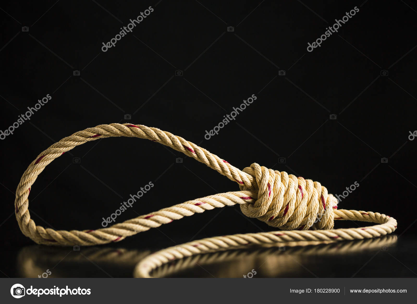 Brown rope noose dark and light on black table with black backgr