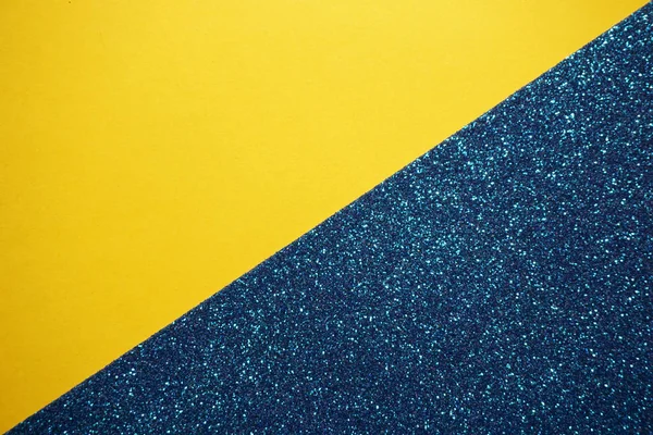 Barva žluté a modré papíry pozadí s třpytkami — Stock fotografie