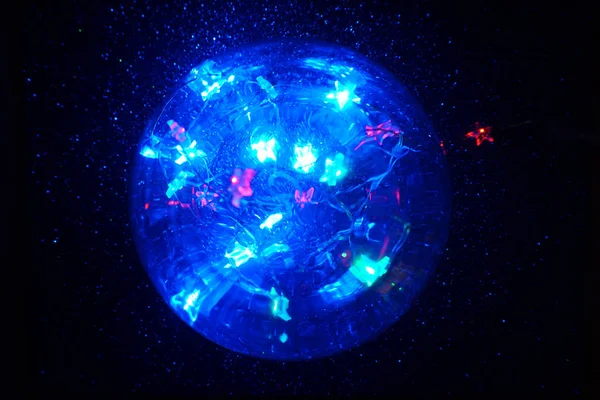 Magic crystal lights ball with defocused stars. Halloween concept. Christmas concept.