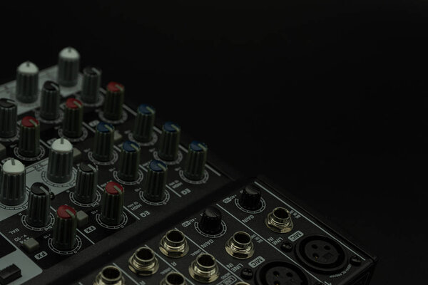 Analog mixer for music studio with selected focus, isolated in black background with space for copy and paste, music concept