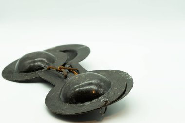 Krakebs. Isolated Moroccan castanets on a white background located on the right of the image. Concept musical instruments.