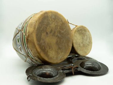 Krakebs and Moroccan bongos. Isolated traditional Moroccan instruments on a white background. Concept musical instruments.