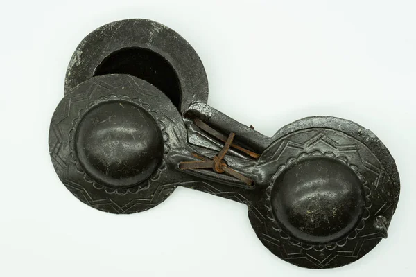 Top view of Krakebs. Isolated Moroccan percussion instrument on a white background Musical instrument concept.