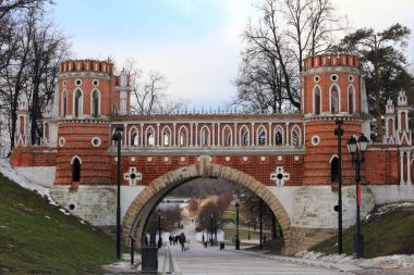 Ancient bridge in Moscow city park in autumn. Beautiful landscape of the historical monument