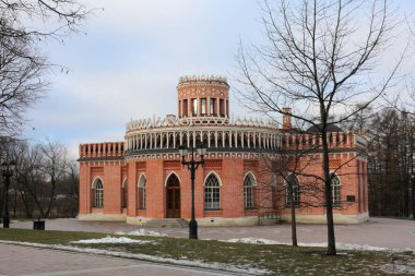 Ancient historical building in Moscow city park in autumn. Beautiful landscape of tourist destination