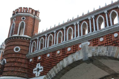Ancient bridge in Moscow city park in autumn. Beautiful landscape of the historical monument