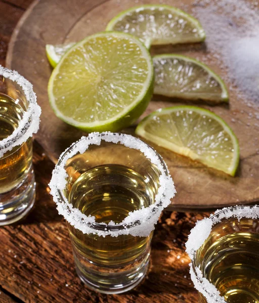 Tequila shots on wooden background — Stock Photo, Image