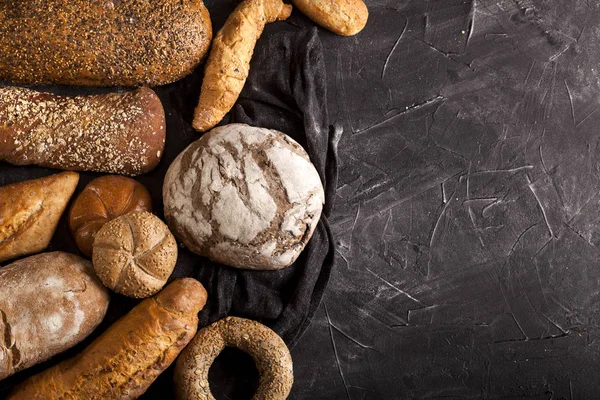 Assortment of baked goods on dark background — Stock Photo, Image