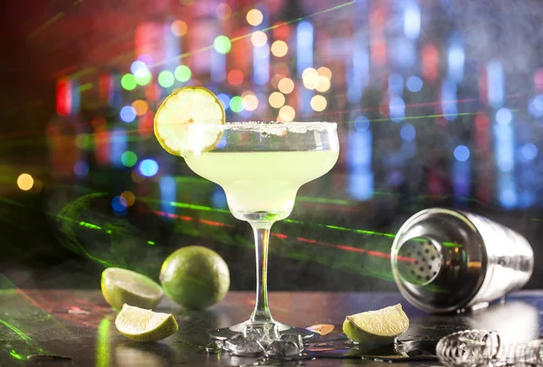 Glass with margarita cocktail on a bar — Stock Photo, Image