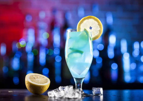 Glass with blue cocktail on a bar — Stock Photo, Image