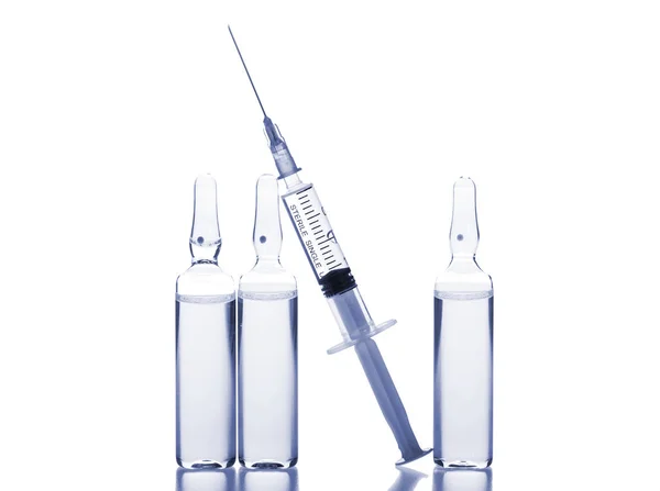 Glass medicine ampoules and Syringe on white background — Stock Photo, Image