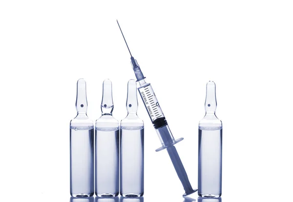 Glass medicine ampoules and Syringe on white background — Stock Photo, Image