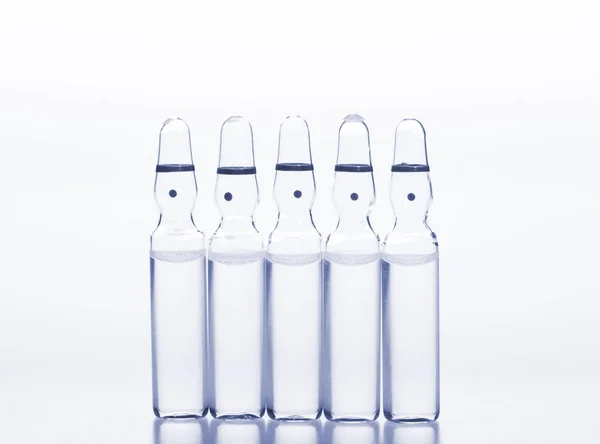 Glass medicine ampoules on a white background — Stock Photo, Image