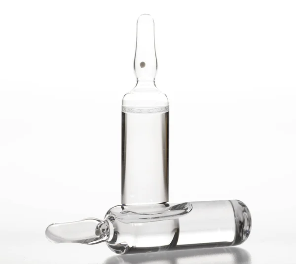 Glass medicine ampoules on a white background Stock Picture