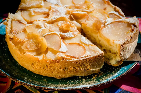 Apple and pear pie on the blue plate