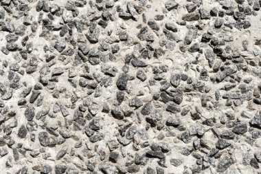 Arkaplan: Büyük granit molozlardan yapılmış beton ürün