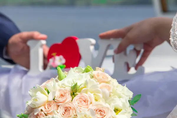 Brides Hold Love Hands Wedding Bouquet Blurred Background — Stock Photo, Image