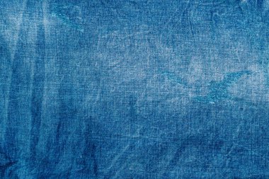 Açık mavi, pejmürde kot. Denim kumaşı. Üretim yıllarında