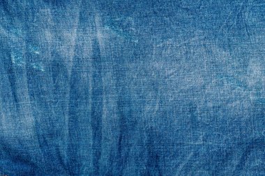 Açık mavi, pejmürde kot. Denim kumaşı. Üretim yıllarında