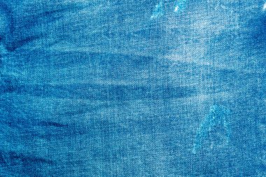 Açık mavi, pejmürde kot. Denim kumaşı. Üretim yıllarında